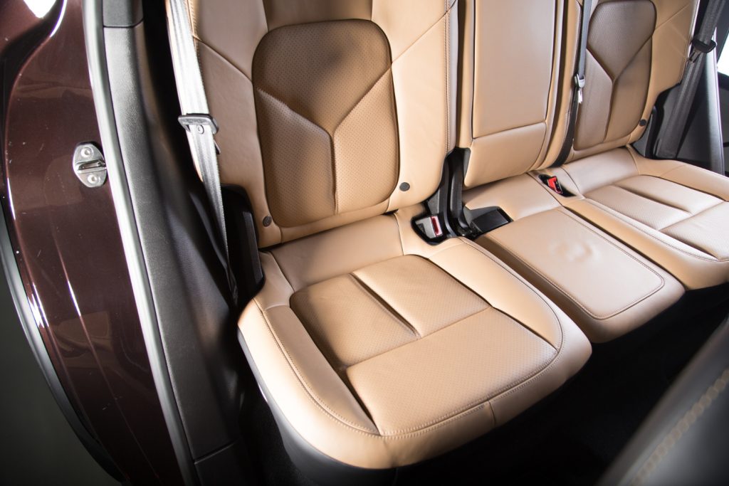 Is leather or synthetic leather upholstery better in cars?